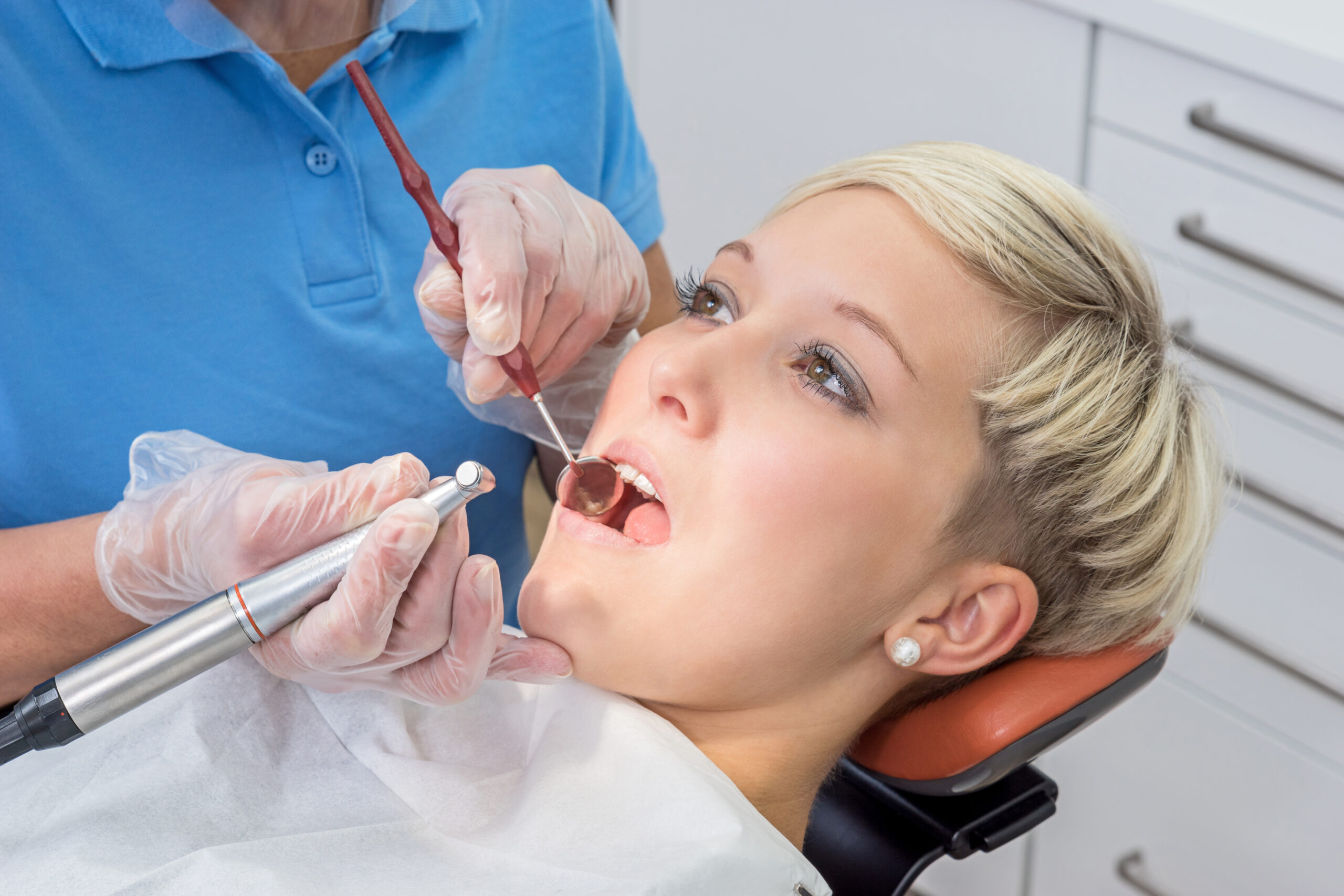 Pretty young woman at the Dentist for partial dentures