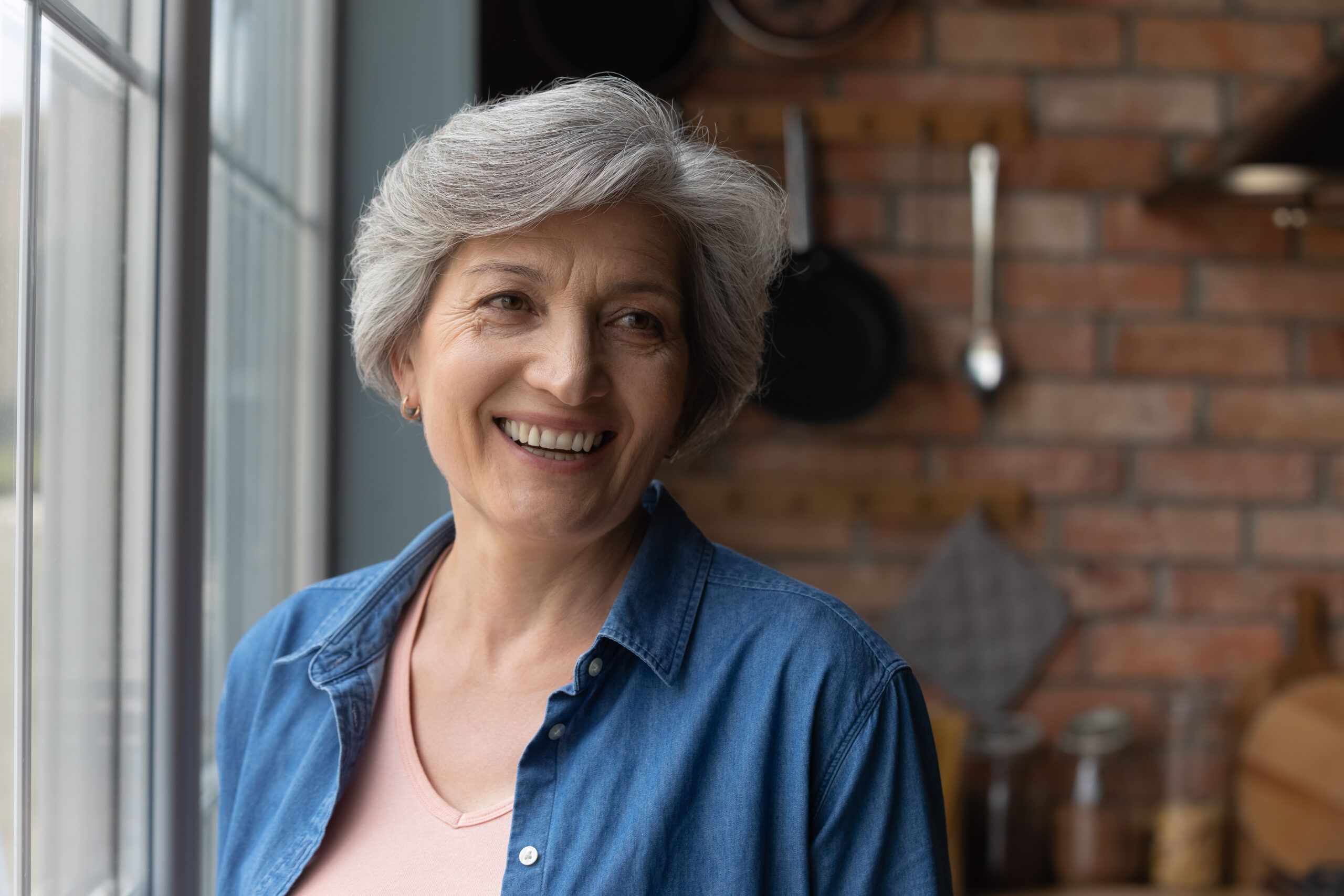 smiling elderly woman wearing dentures