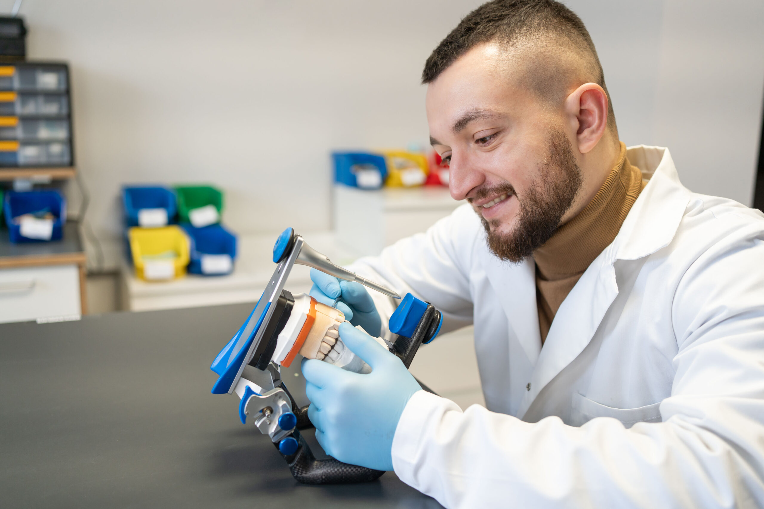 Dental technician doing denture repairs